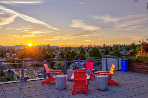 Ballard Lofts Rooftop deck seating area at sunset